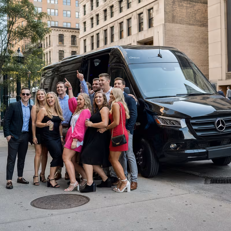 Group boarding a white charter bus for Bachelor & Bachelorette Transportation transportation in Indianapolis