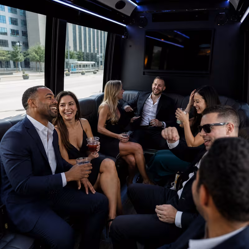 Party bus interior with wraparound leather seating and LED lighting in Indianapolis