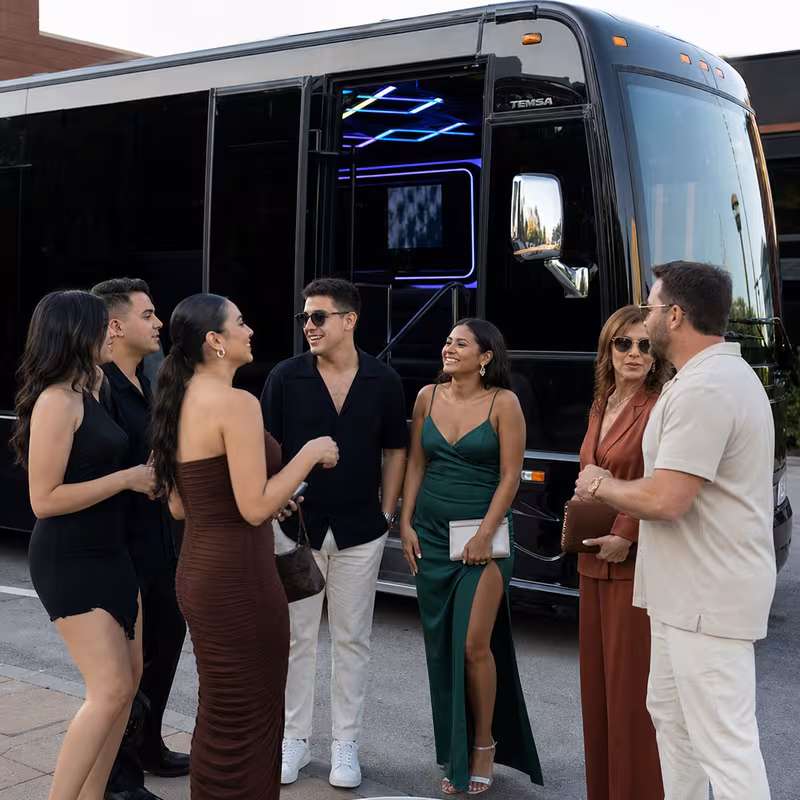 Passengers loading luggage while boarding an Indianapolis group shuttle