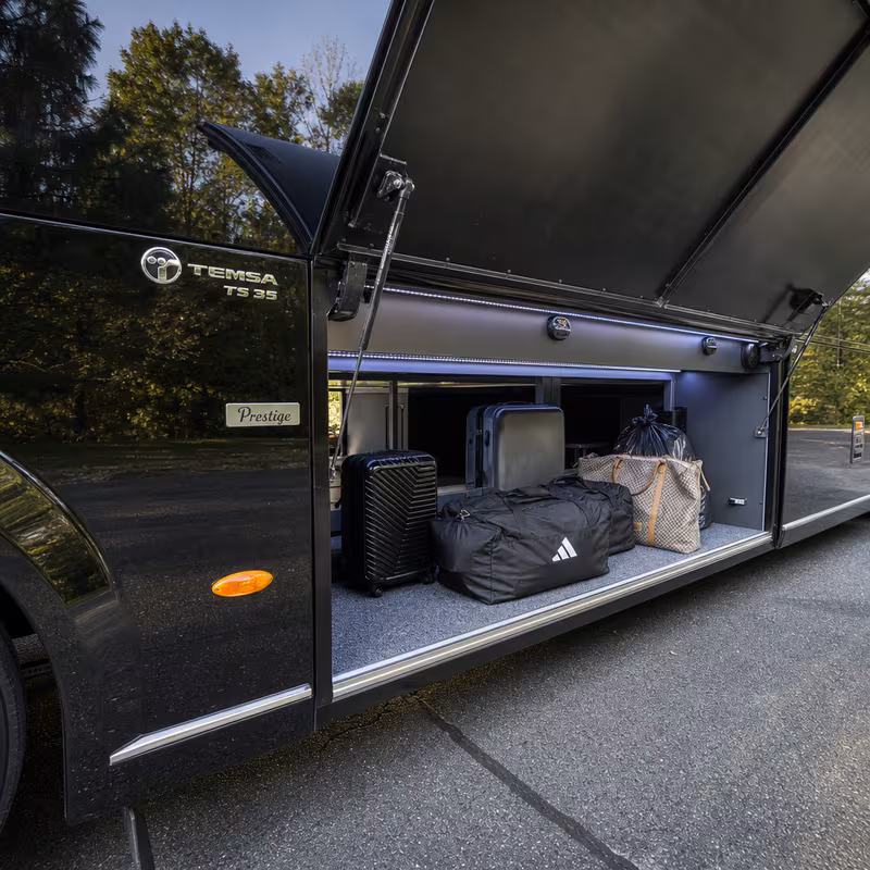 Party bus interior with wraparound leather seating and LED lighting in Indianapolis