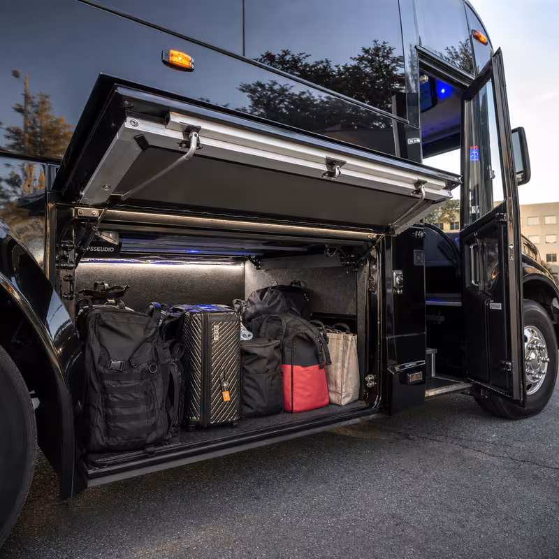 Party bus interior with wraparound leather seating and LED lighting in Indianapolis