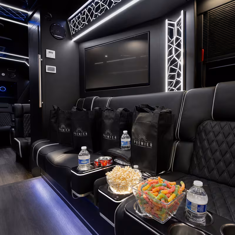 Party bus interior with wraparound leather seating and LED lighting in Indianapolis